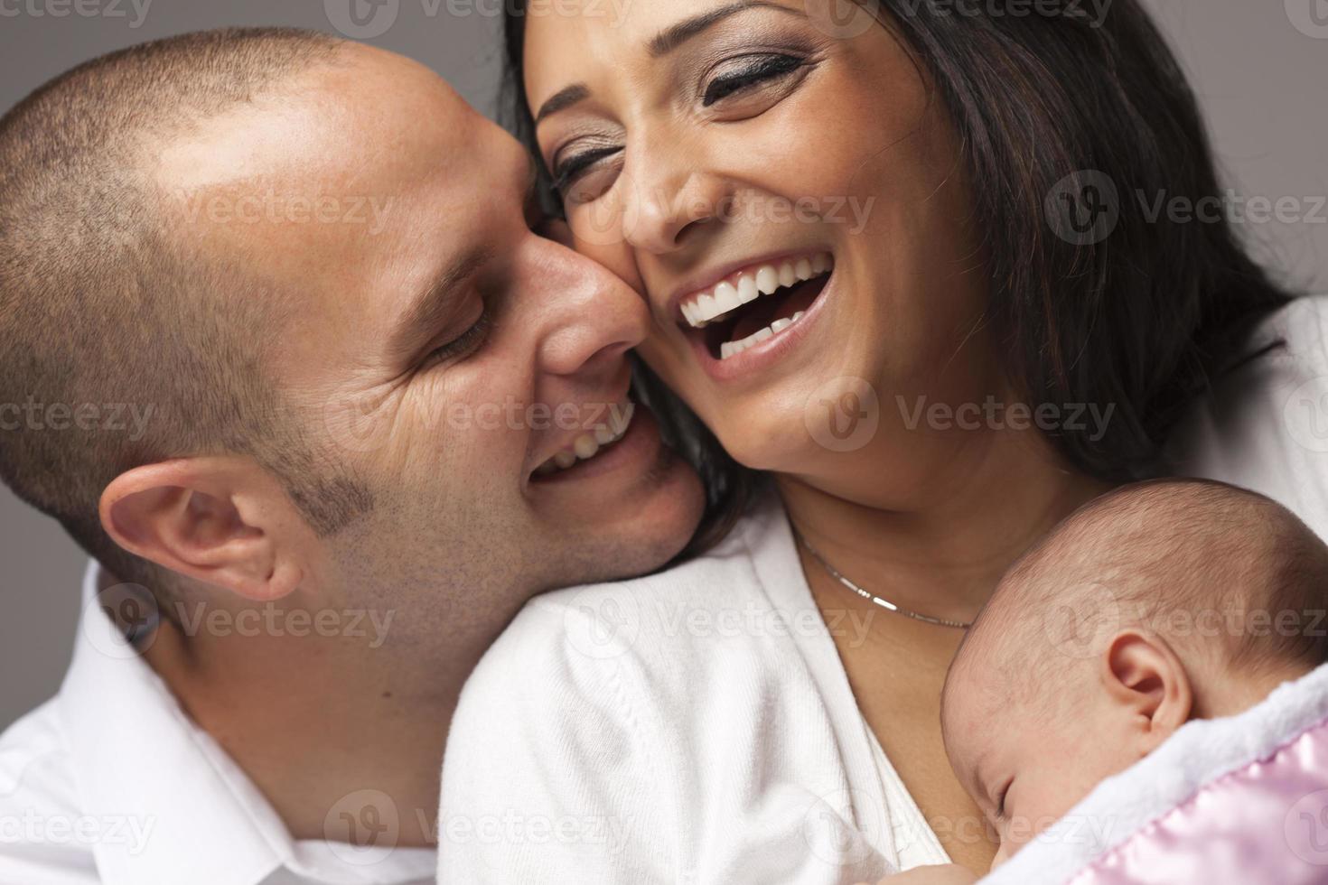 Mixed Race Young Family with Newborn Baby photo