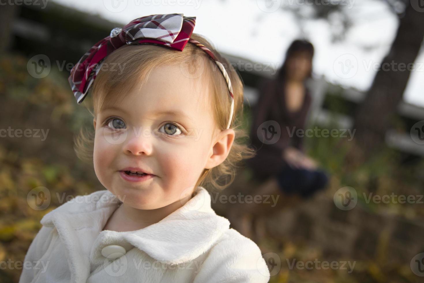 Adorable Baby Girl Playing in Park with Mom photo