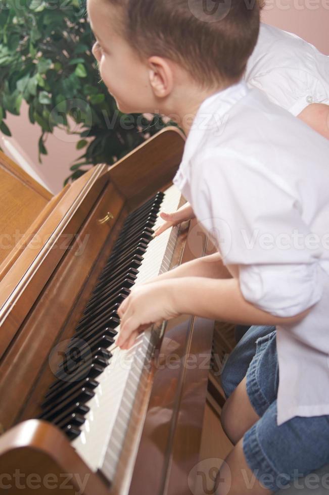 Children Playing the Piano photo