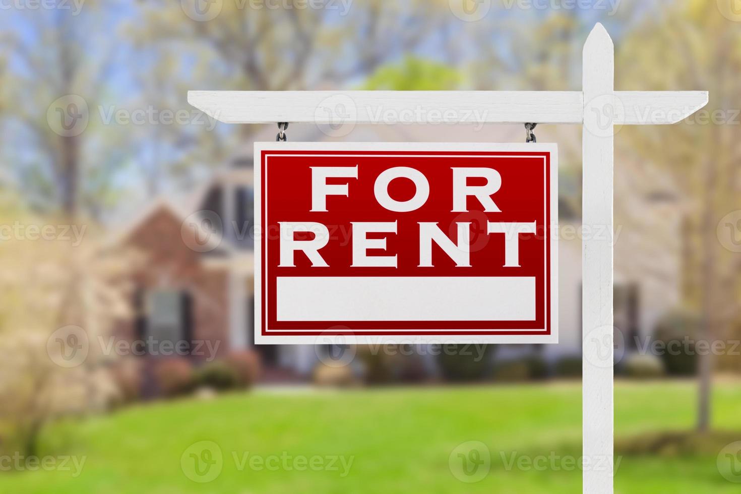 Left Facing For Rent Real Estate Sign In Front of House. photo