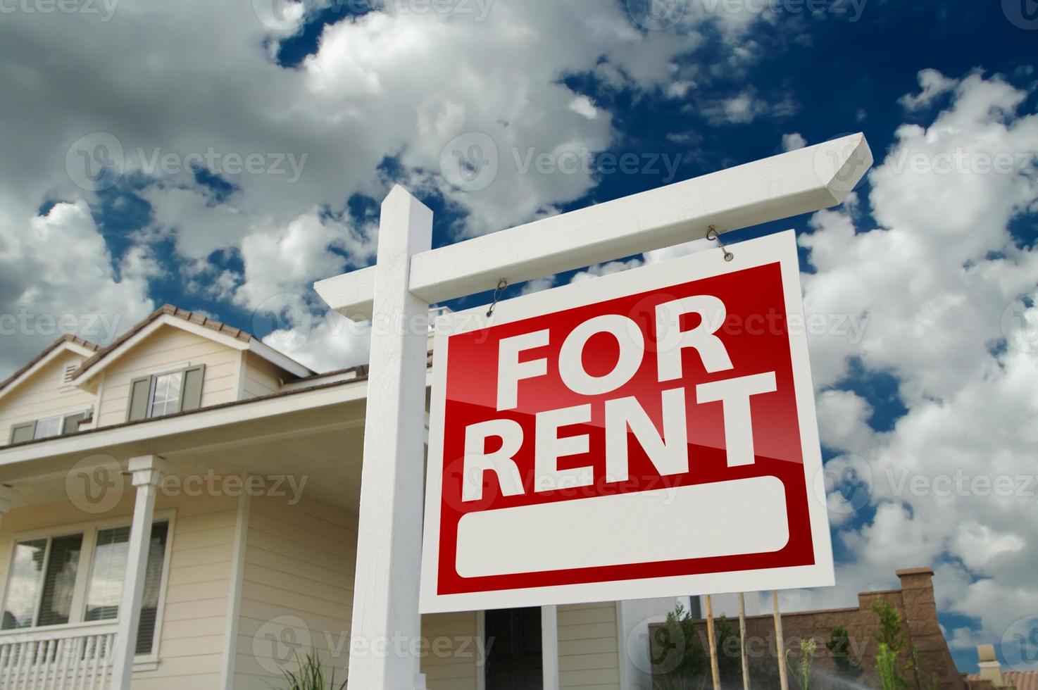 For Rent Real Estate Sign in Front of House photo