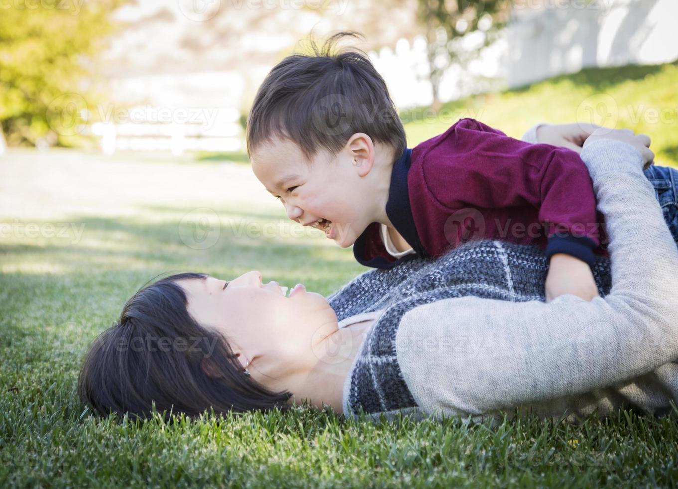 Chinese Mother Having Fun with Her Mixed Race Baby Son photo