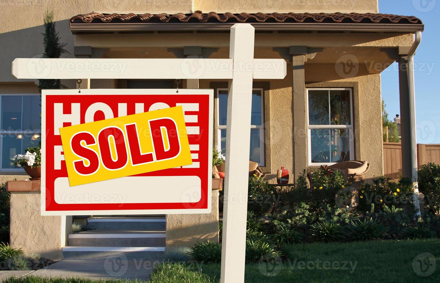 Sold Home For Sale Sign in Front of New House photo