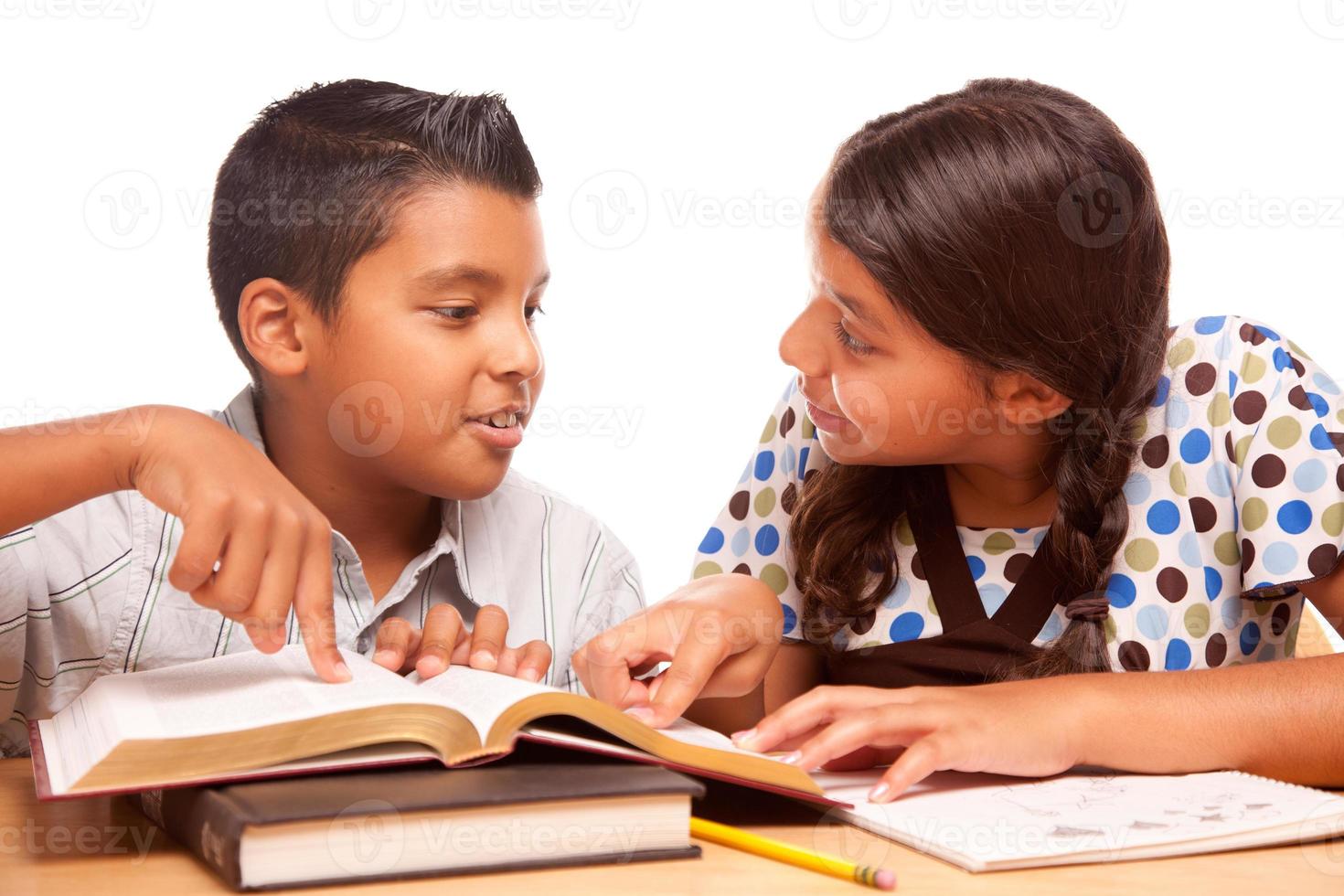 Hispanic Brother and Sister Having Fun Studying photo