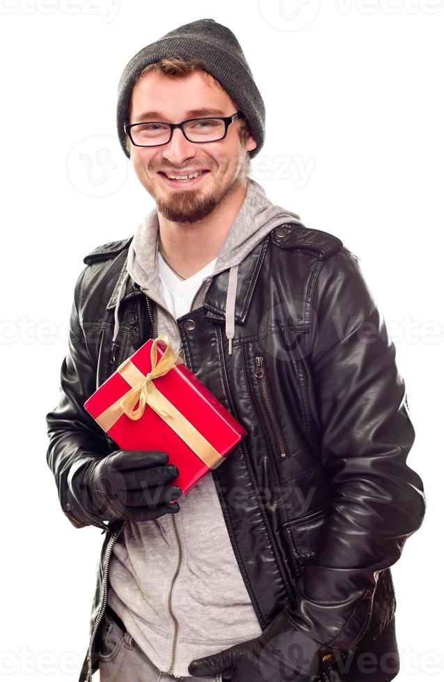 Warmly Dressed Handsome Young Adult Holding Gift photo