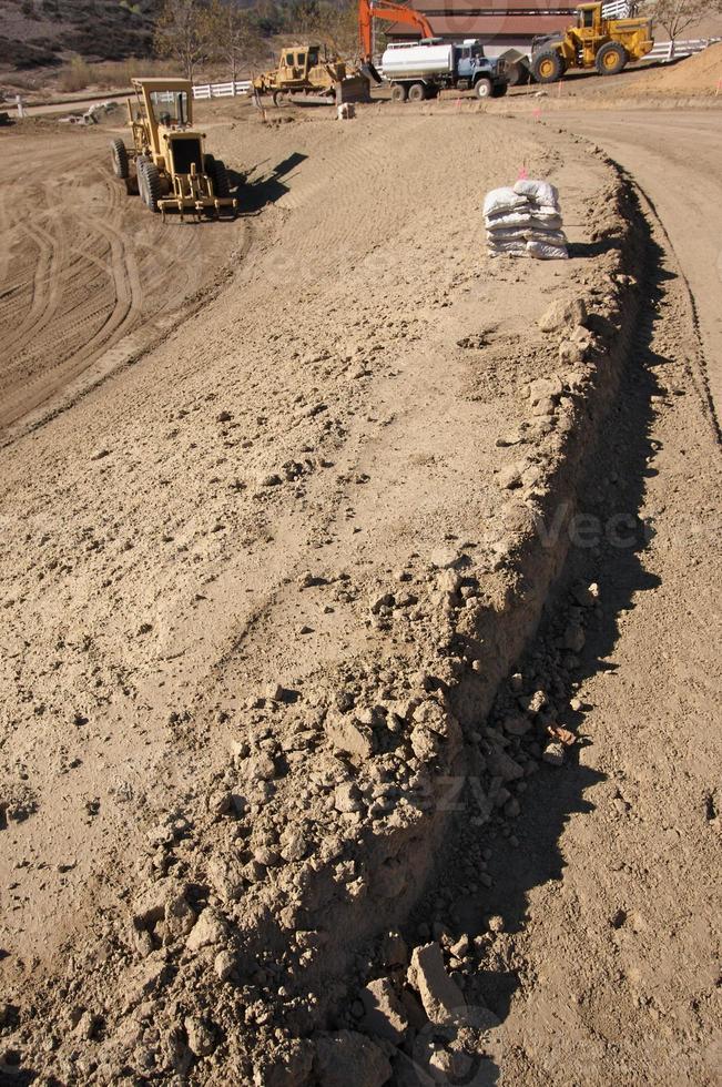 Sandbags and  Machinery at Construction Site photo