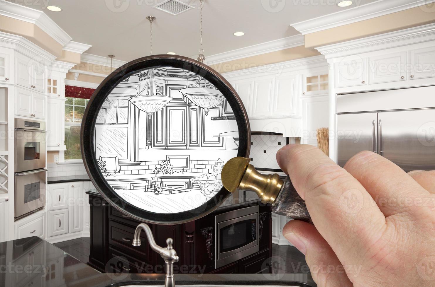 Hand Holding Magnifying Glass Revealing Custom Kitchen Design Drawing and Photo Combination