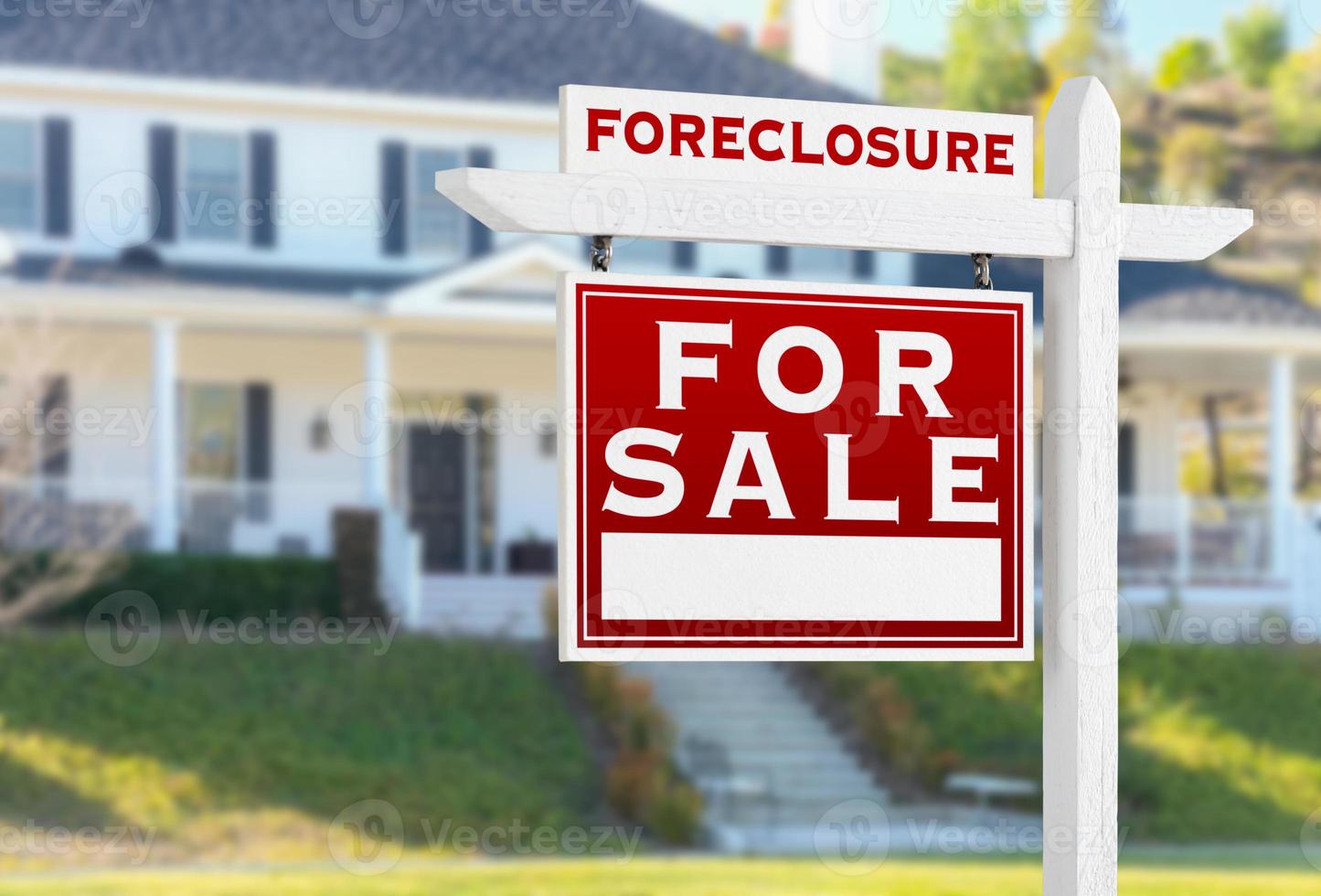 Left Facing Foreclosure For Sale Real Estate Sign in Front of House. photo