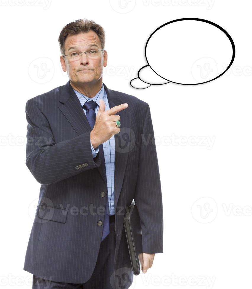 Businessman Pointing to the Blank Thought Bubble on White photo