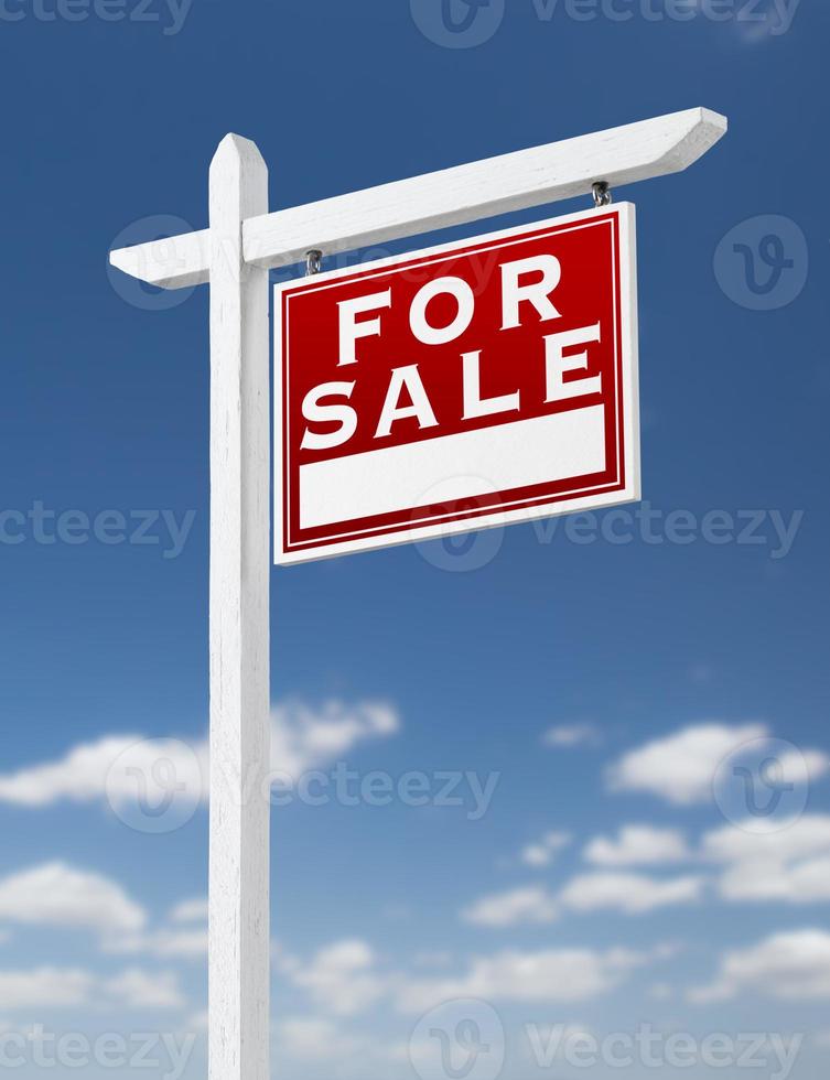 Right Facing For Sale Real Estate Sign on a Blue Sky with Clouds. photo