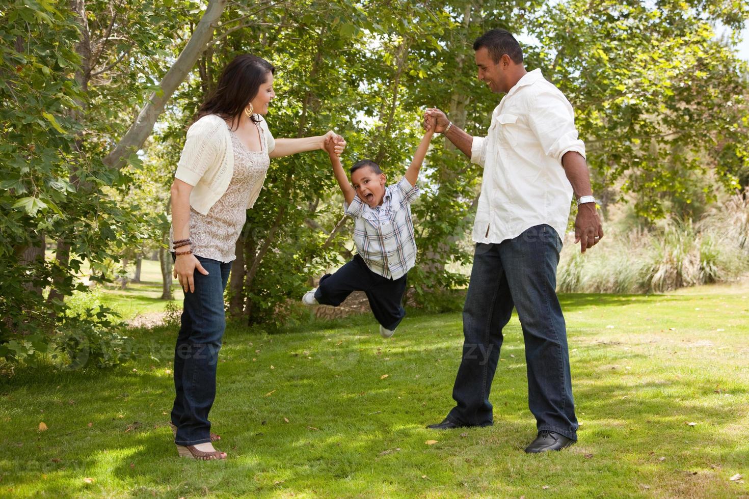 Young Hispanic Family Having Fun in the Park photo