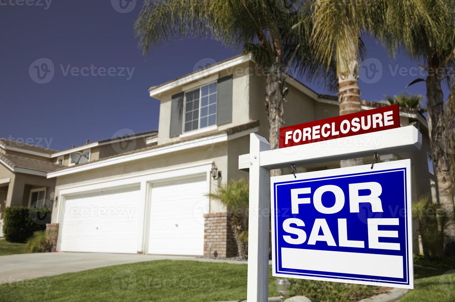 Blue Foreclosure For Sale Real Estate Sign and House photo