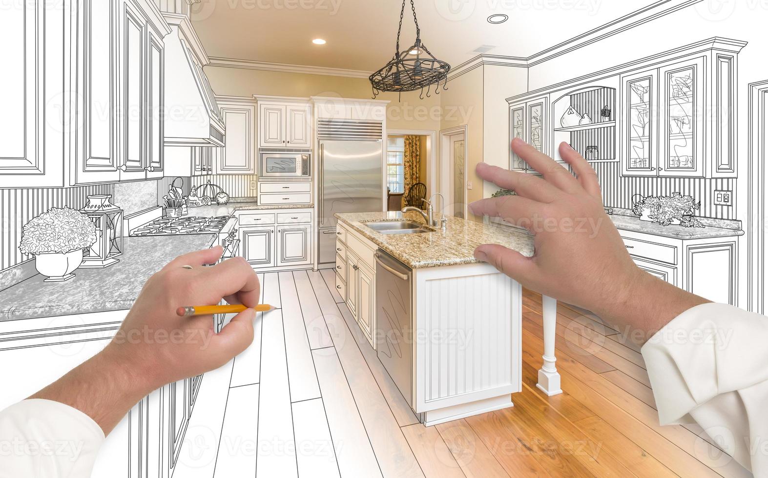 Male Hands Sketching Custom Kitchen with Photo Showing Through