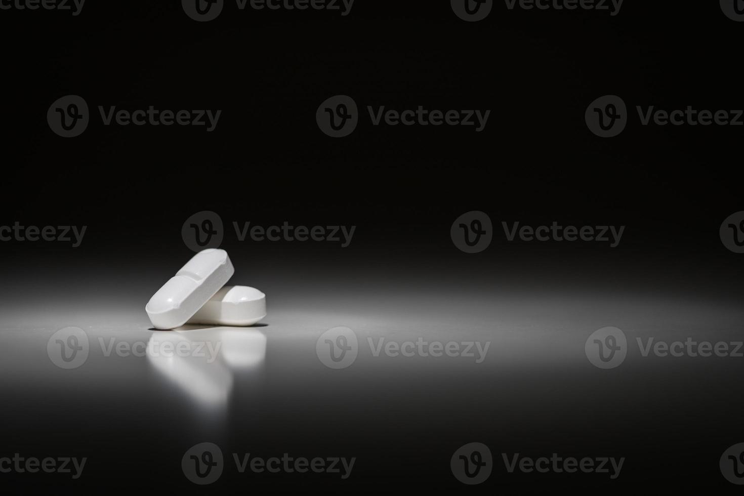 Hydrocodone Prescription Pills Under Spot Light. photo