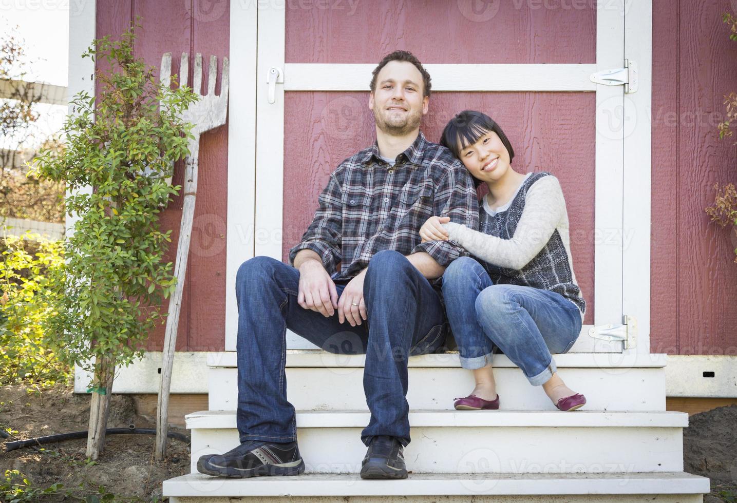 Mixed Race Couple Relaxing on the Steps photo