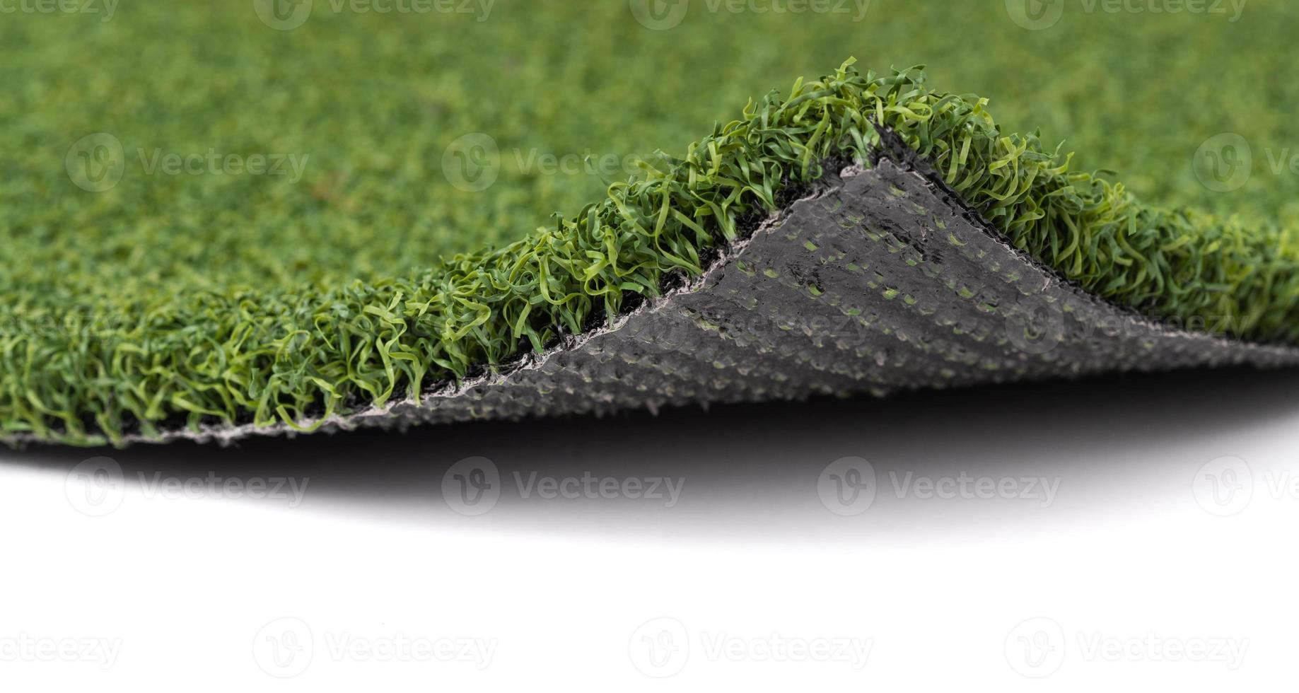 Flipped Up Section of Artificial Turf Grass On White Background photo