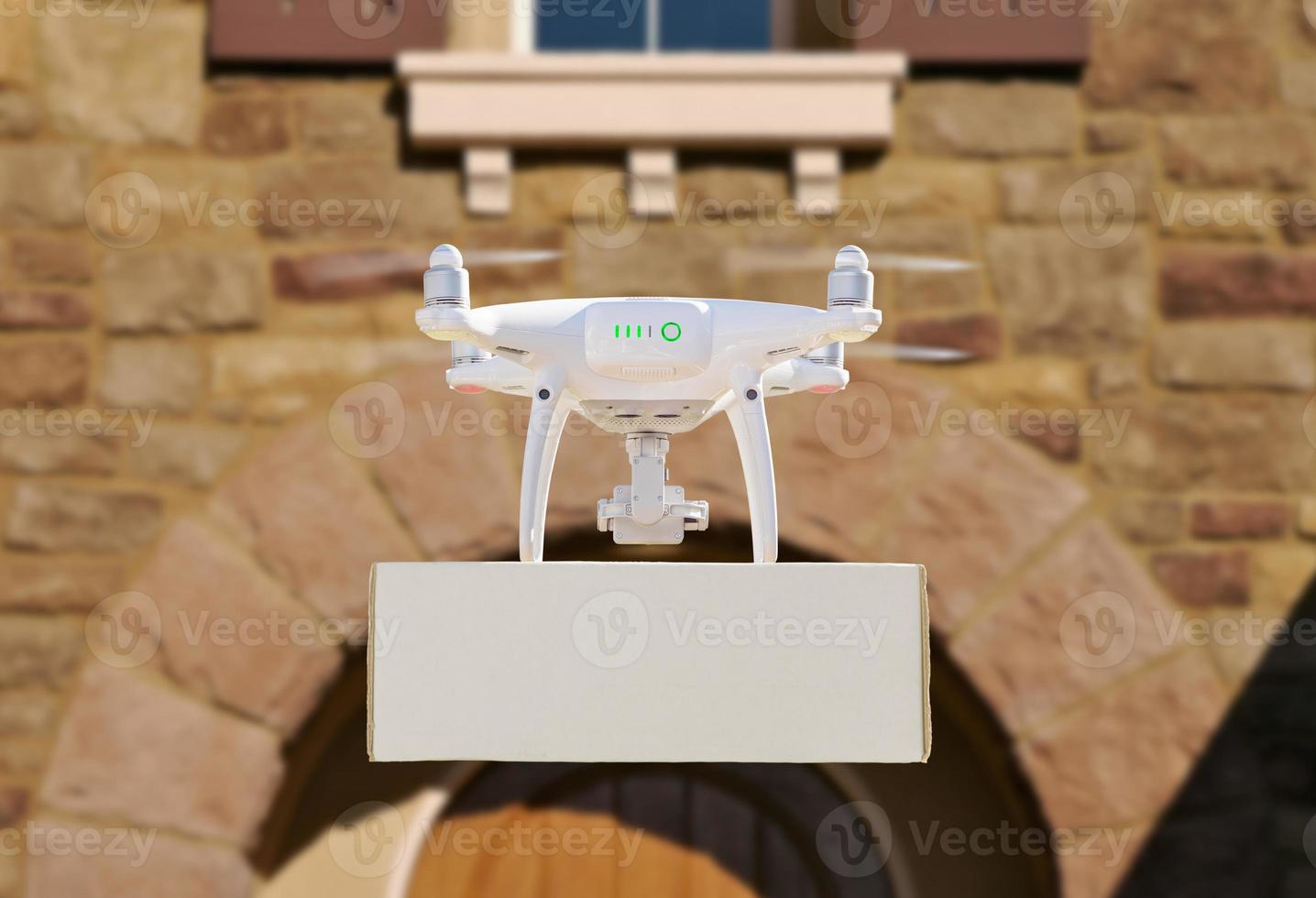 Drone Delivering Package to House Porch photo