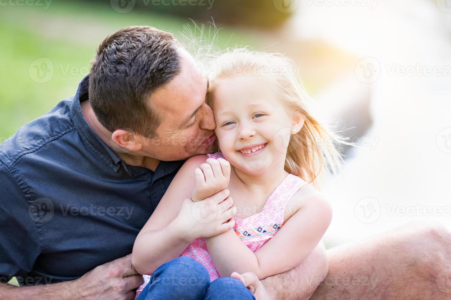 Young Caucasian Father and Daughter Having Fun At The Park photo