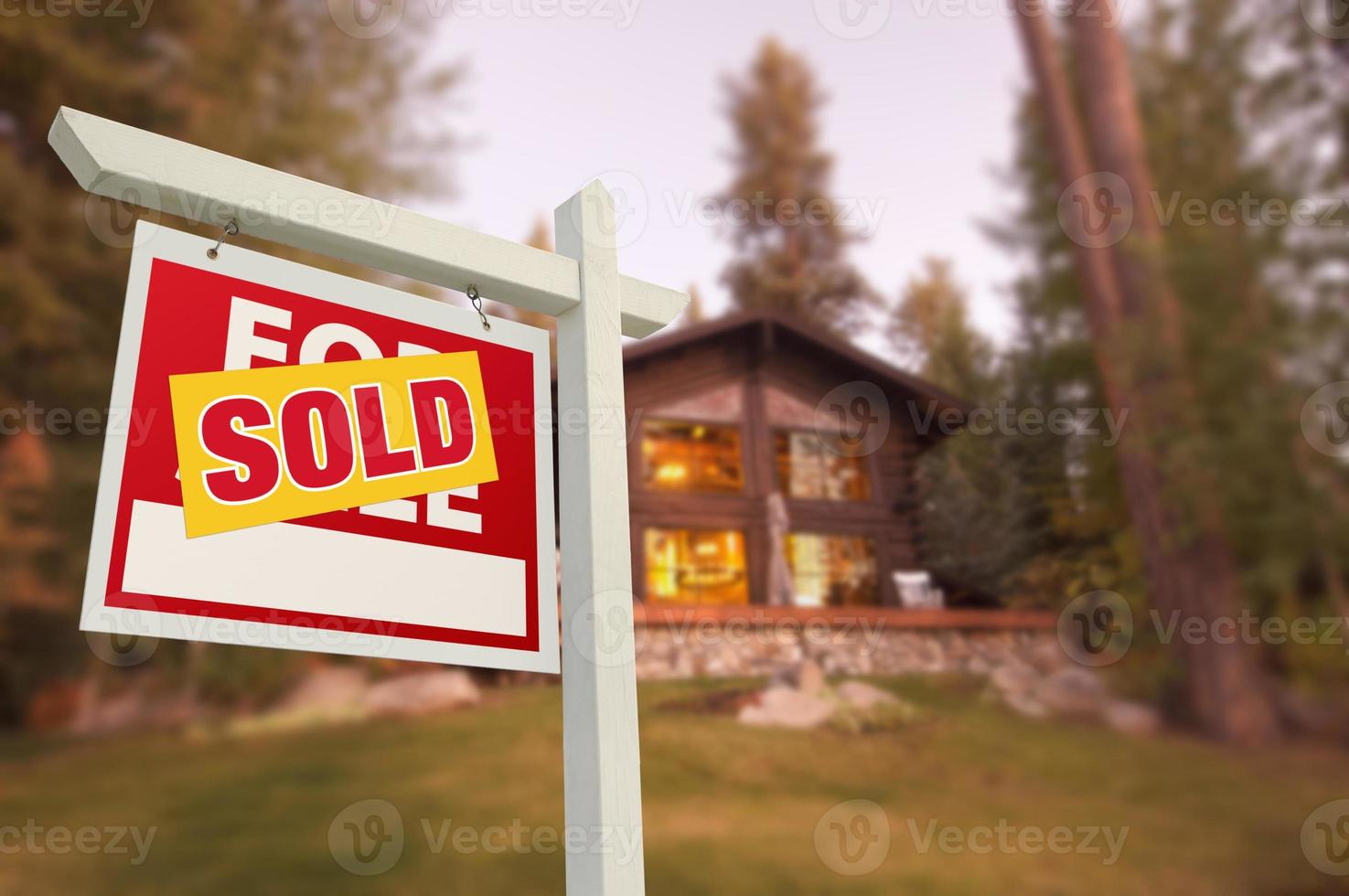 Sold Home For Sale Sign and Beautiful Log Cabin photo
