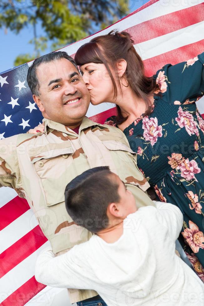 Male Hispanic Armed Forces Soldier Celebrating His Return Holding American Flag photo