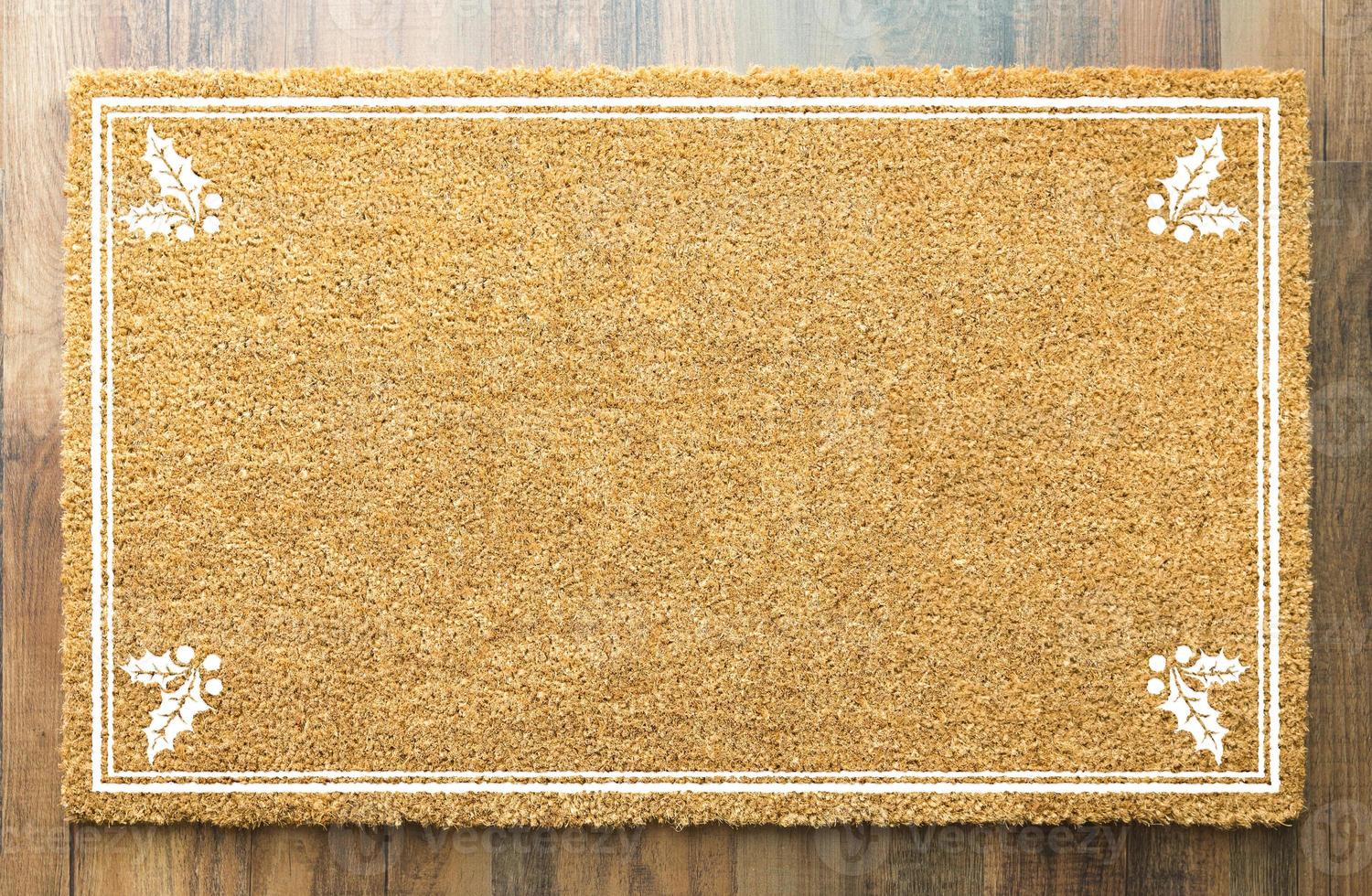 Blank Holiday Welcome Mat With Holly On Wood Floor Background photo