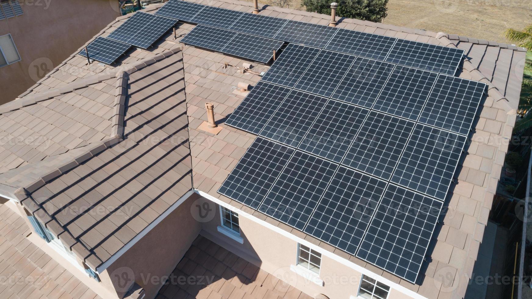 Solar Panels Installed on Roof of Large House photo