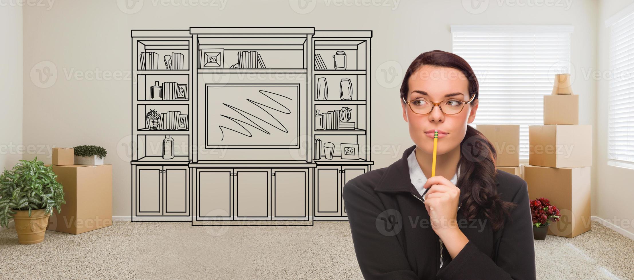 Woman Inside Room With Moving Boxes Glancing Toward Entertainment Unit Drawing on Wall photo