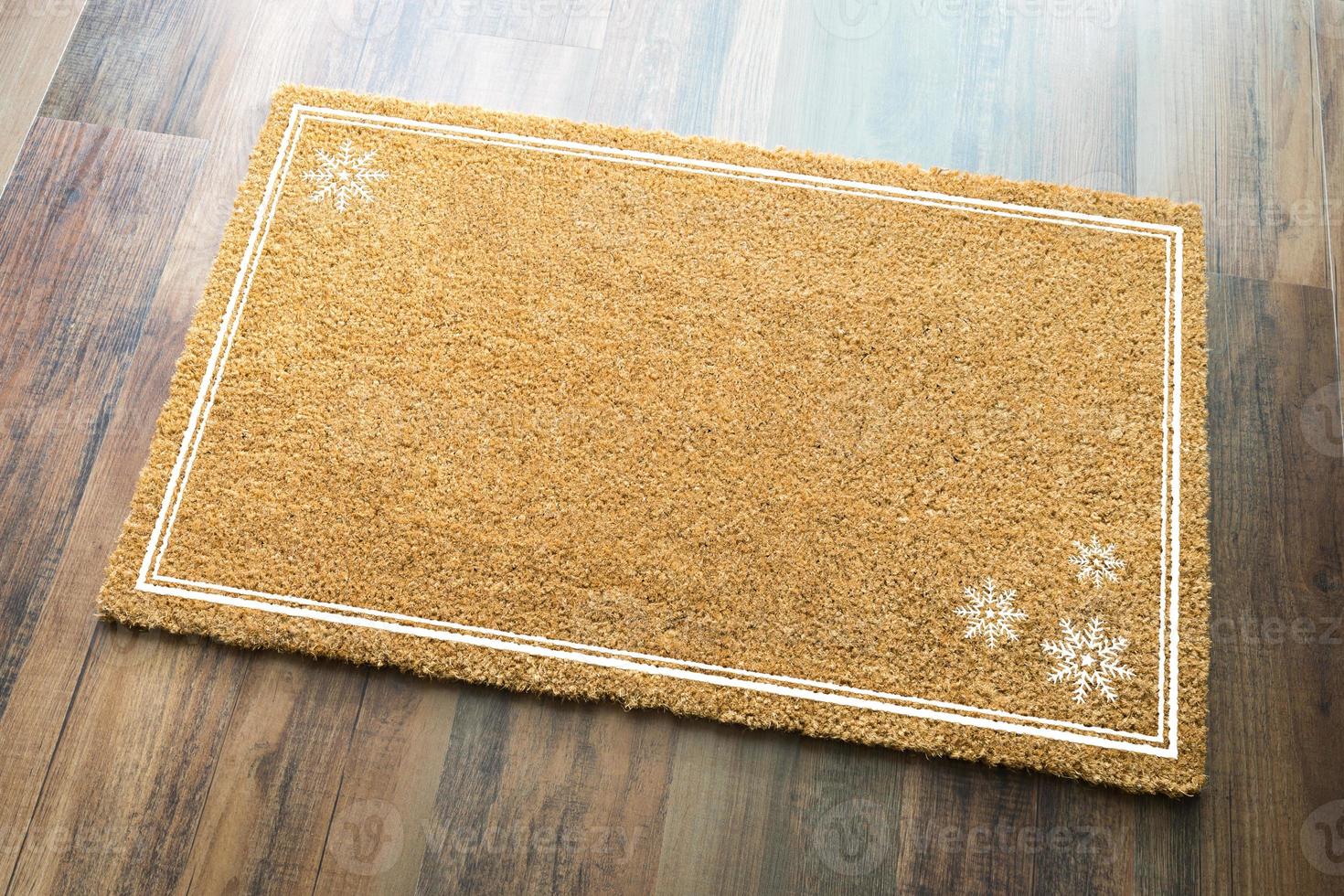 Blank Holiday Welcome Mat With Snow Flakes On Wood Floor Background photo