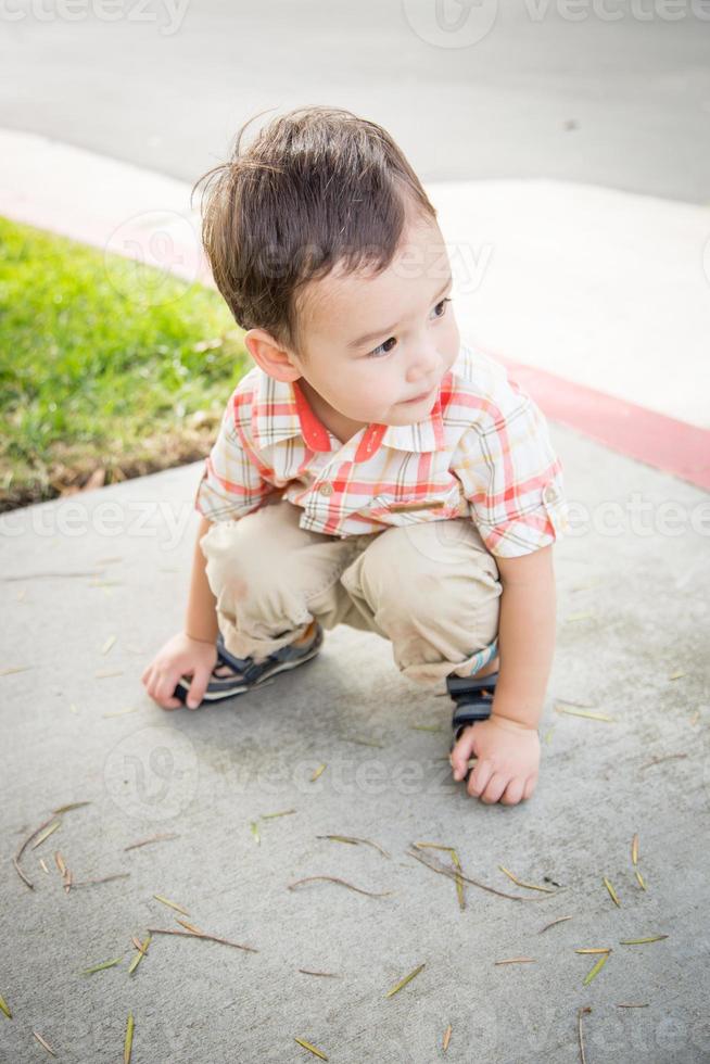 Young Chinese and Caucasian Boy Having Fun at the Park. photo