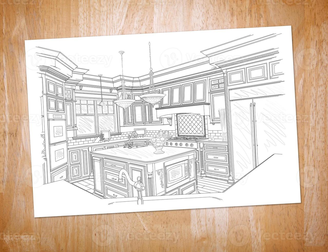 dibujo de cocina personalizado en papel que descansa sobre un escritorio de madera foto