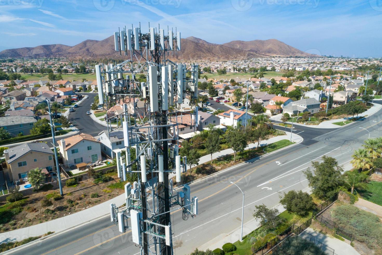 Close-up Aerial of Cellular Wireless Mobile Data Tower with Neighborhood Surrounding photo