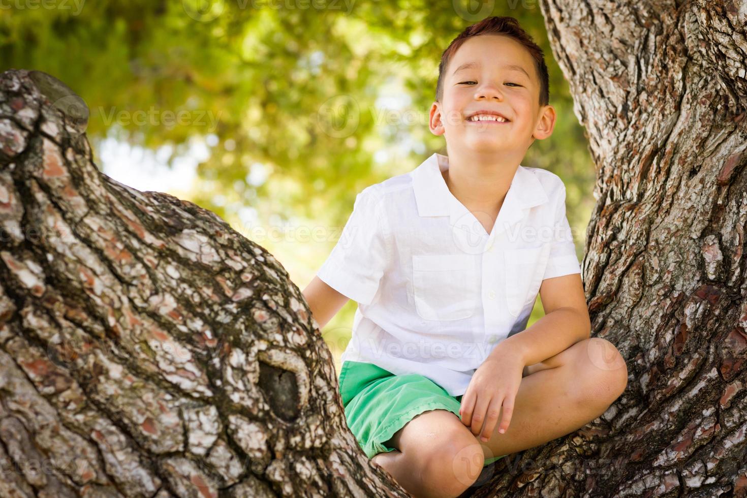 Outdoor portrait of a biracial Chinese and Caucasian boy. photo