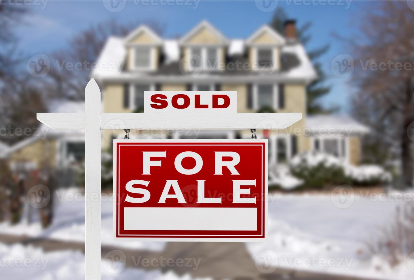 Sold Home For Sale Real Estate Sign in Front of New Snow Covered House photo