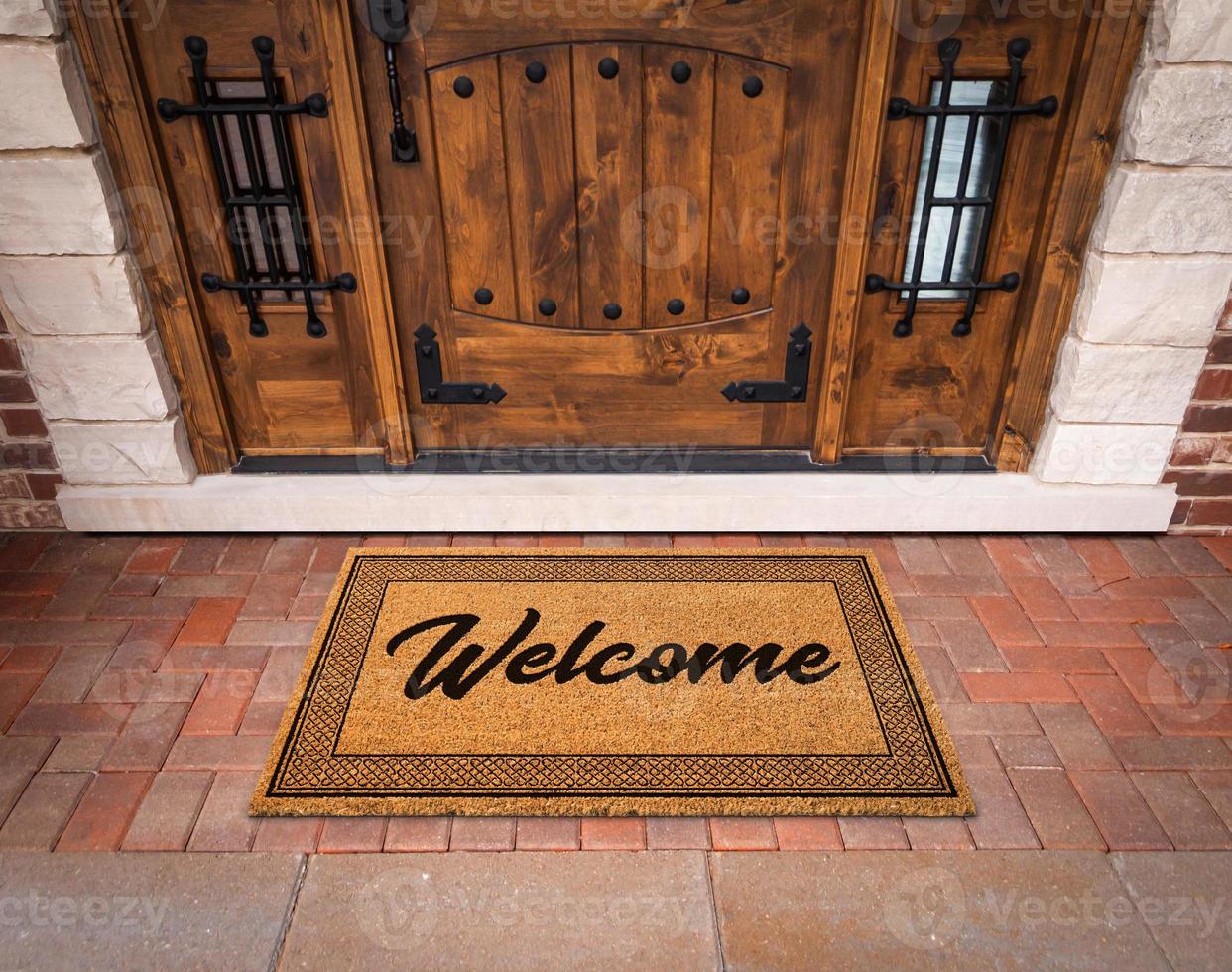 Welcome Mat At Custom Front Door Of House. photo