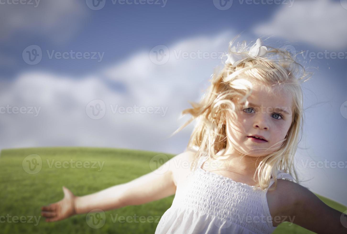 Adorable Blue Eyed Girl Playing Outside photo