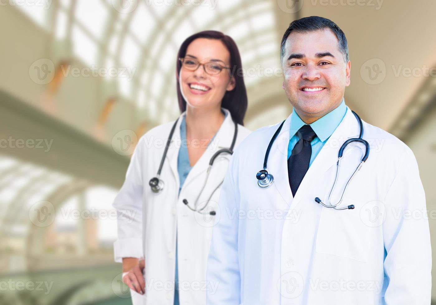 Two Doctors or Nurses Inside Hospital Building photo