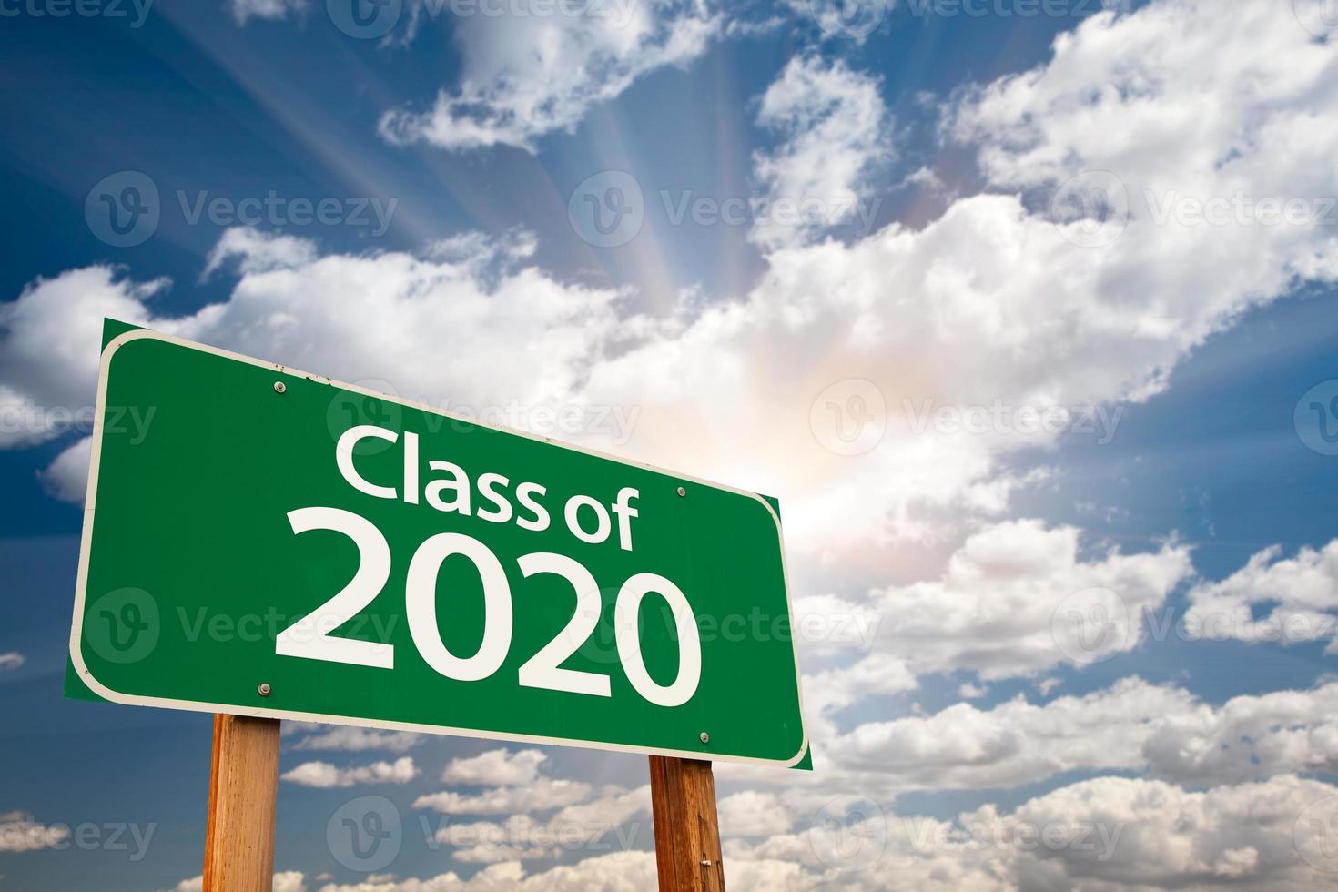 Class of 2020 Green Road Sign with Dramatic Clouds and Sky photo