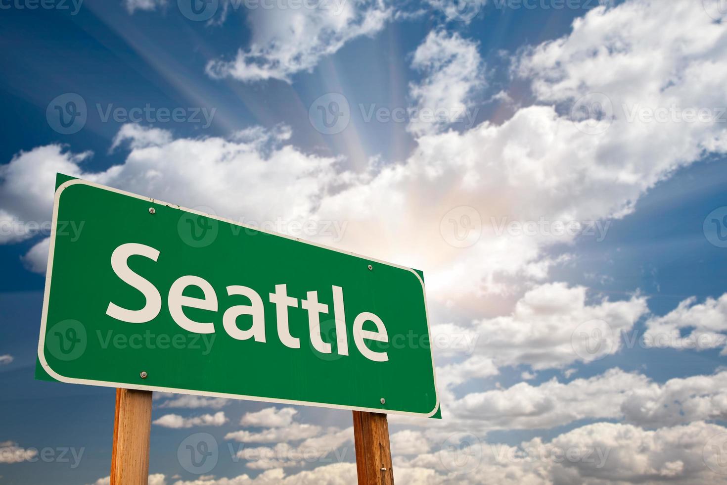 Seattle Green Road Sign Over Clouds photo