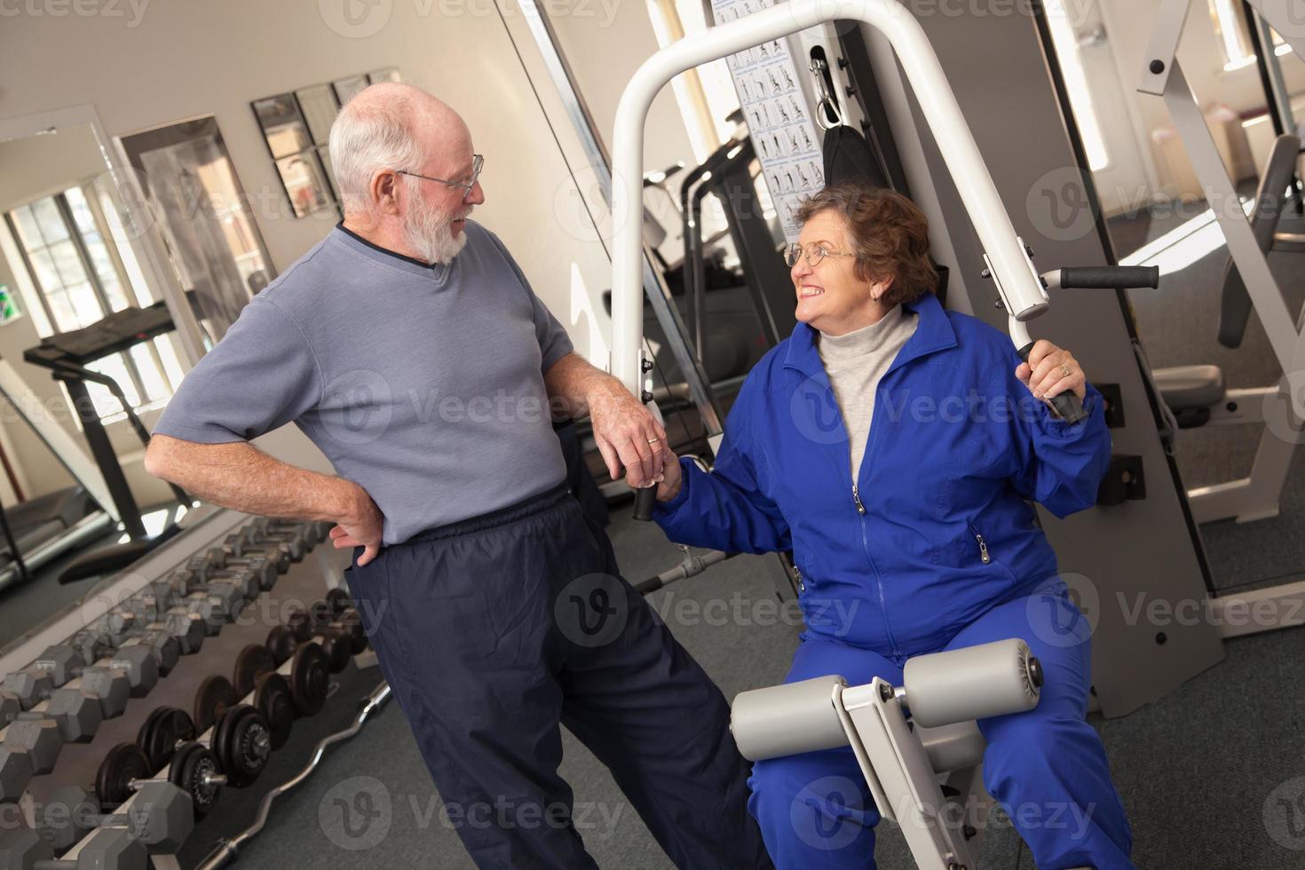 Senior Adult Couple Working Out Together in the Gym photo