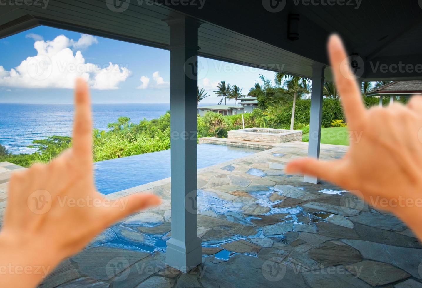 Hands Framing Breathtaking Hawaiian Ocean View Deck photo