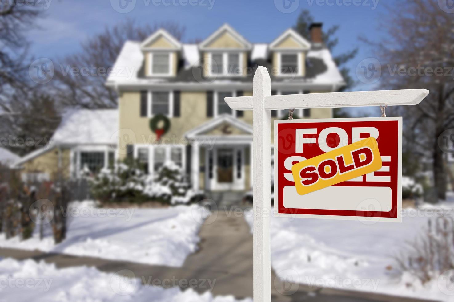 Sold Home For Sale Sign in Front of New House photo