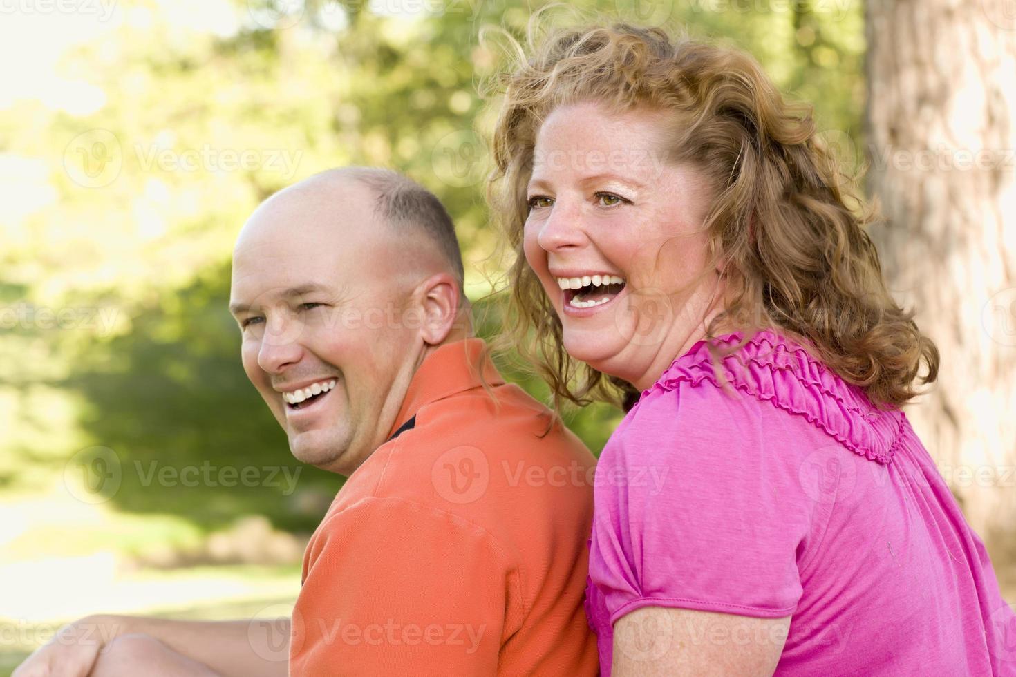 Happy Attractive Couple Laughing in Park photo