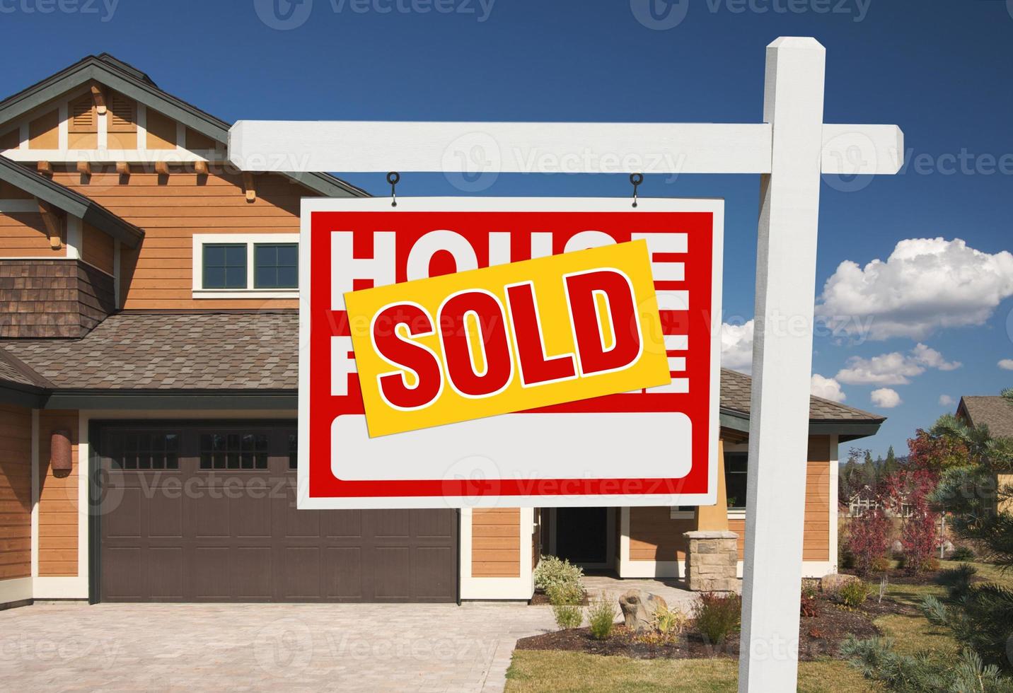 Sold Home For Sale Sign in Front of New House photo