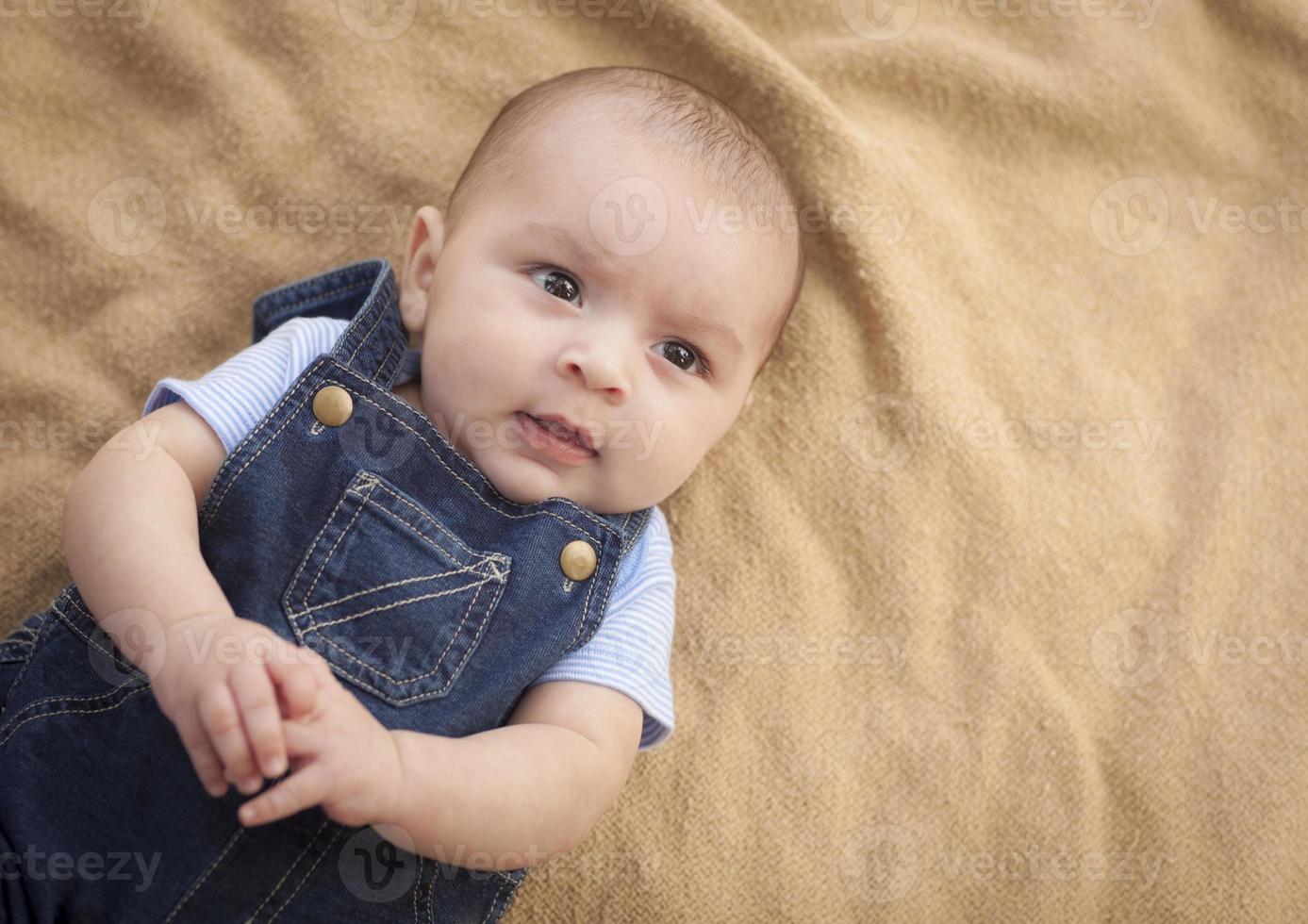 Mixed Race Baby Boy Laying on Blanket photo