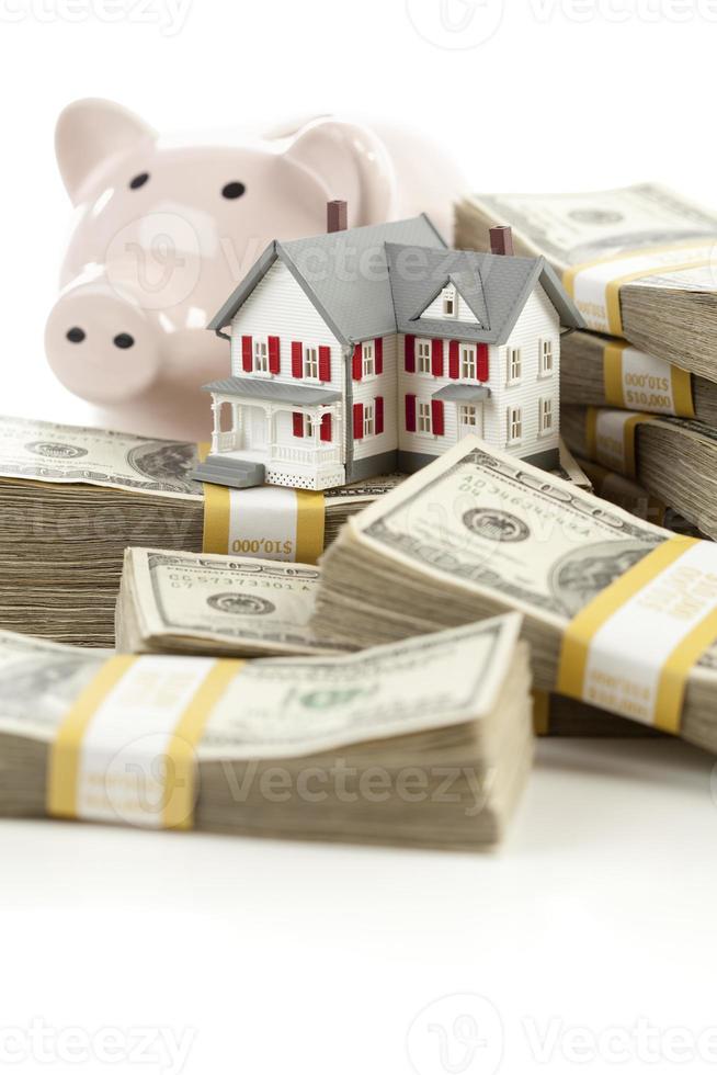 Small House and Piggy Bank with Stacks Money photo