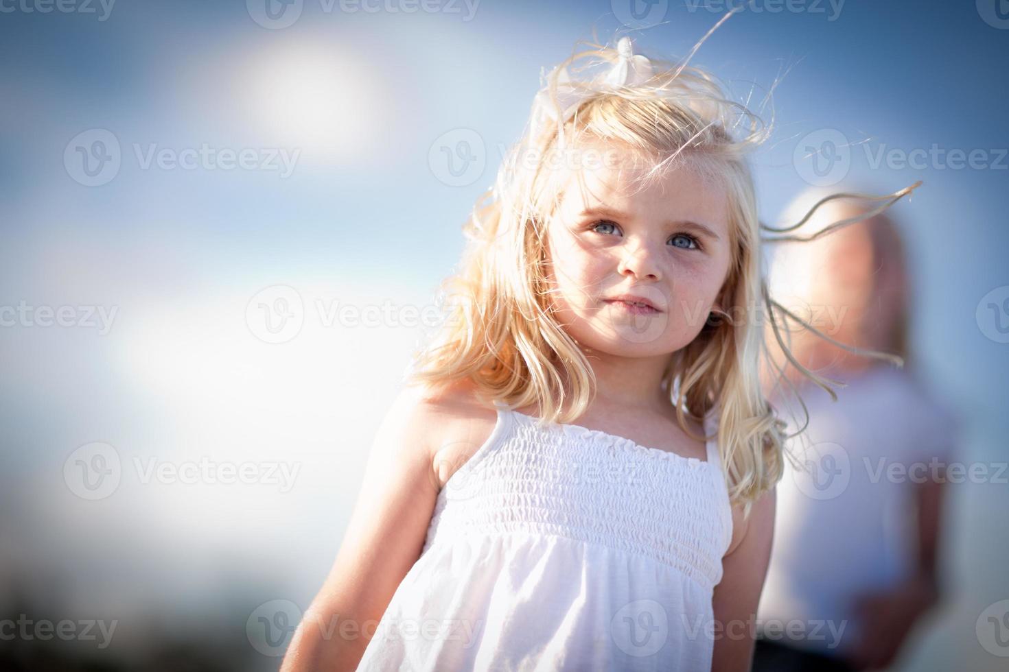 Adorable Blue Eyed Girl Playing Outside photo