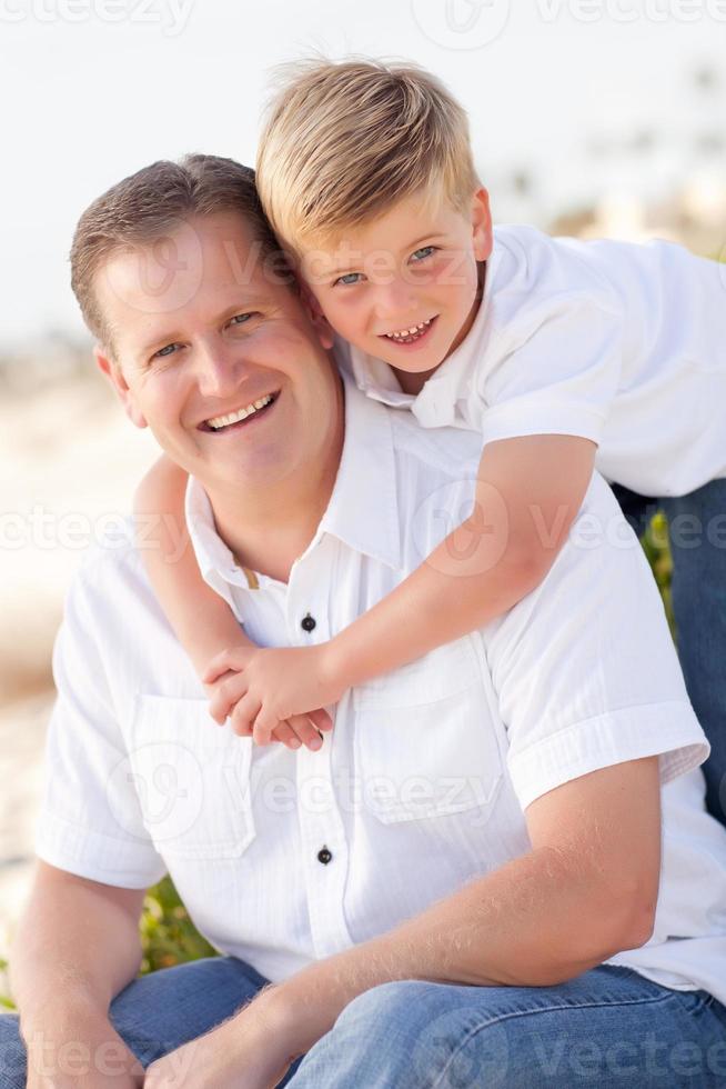Cute Son with His Handsome Dad Portrait Outside photo