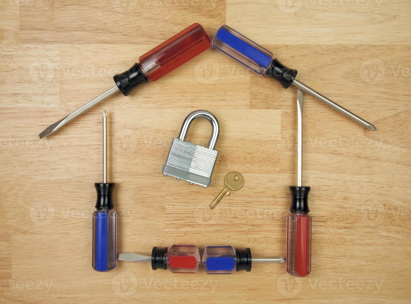 House Shaped by Screwdrivers with Lock and Key photo