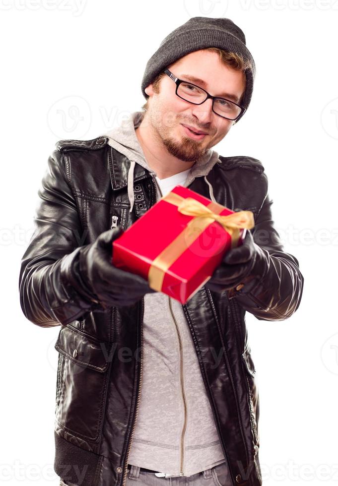 Warmly Dressed Young Man Handing Wrapped Gift Out photo