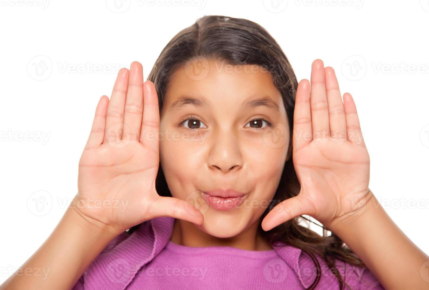 Pretty Hispanic Girl Framing Her Face with Hands photo